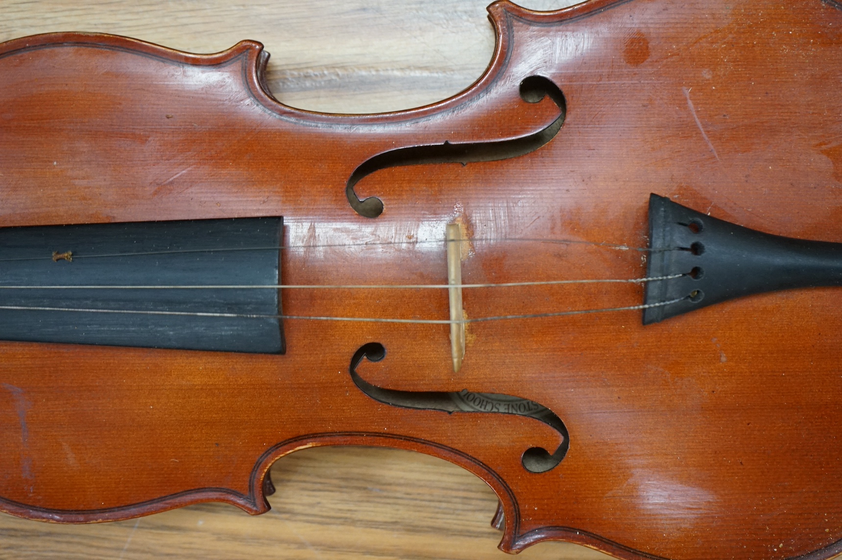 An early 20th century violin, possibly Czech, with internal label for ‘Maidstone Orchestra Association, Oxford St. London’ and bow, in case, length of back of body, 36cm., Condition - fair to good.
